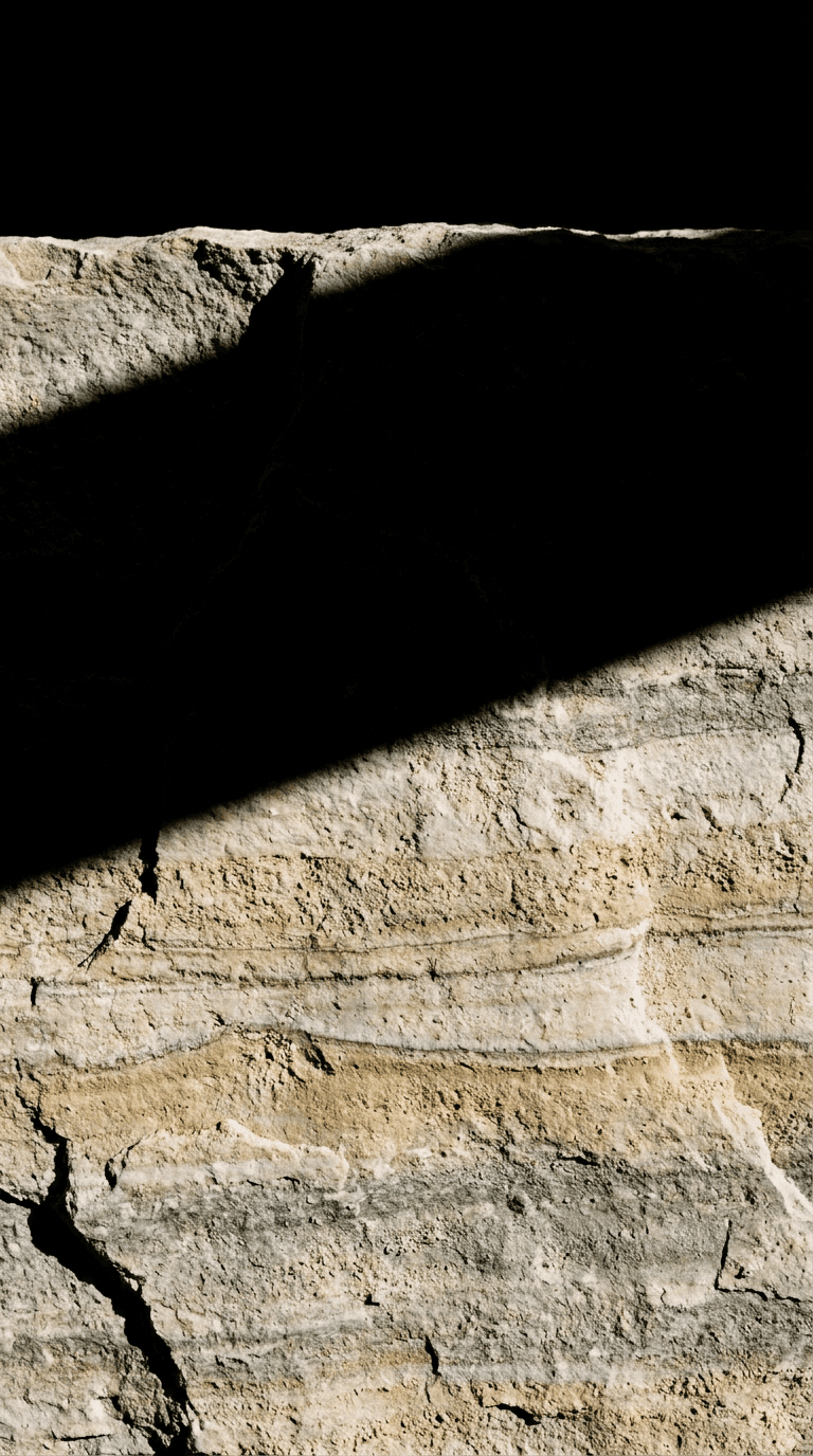 Boucheron — limestone strata cut by a hard shadow