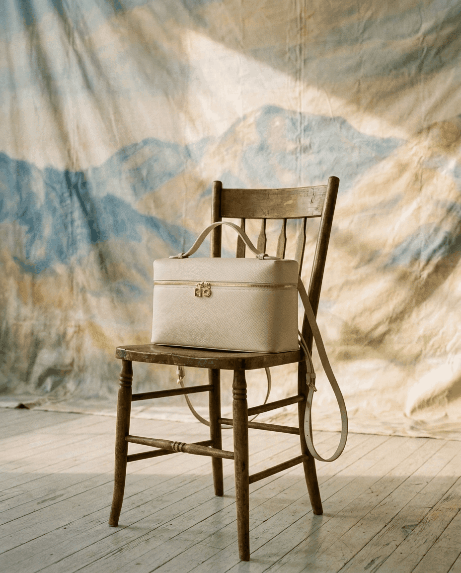 Loro Piana — leather case on a chair against a painted backdrop